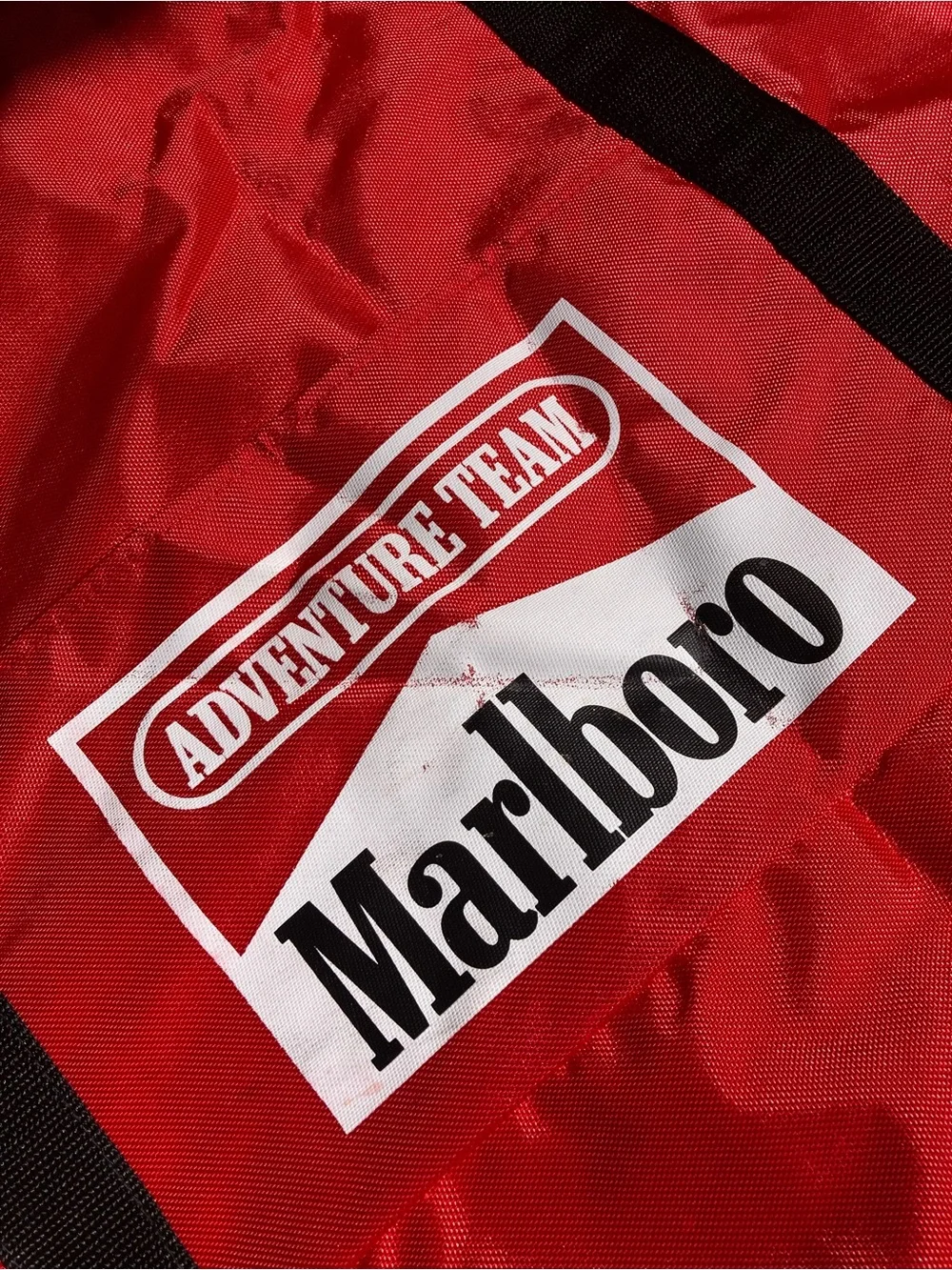 Marlboro Red Duffel with Black Web Handles and Adventure Team Logo